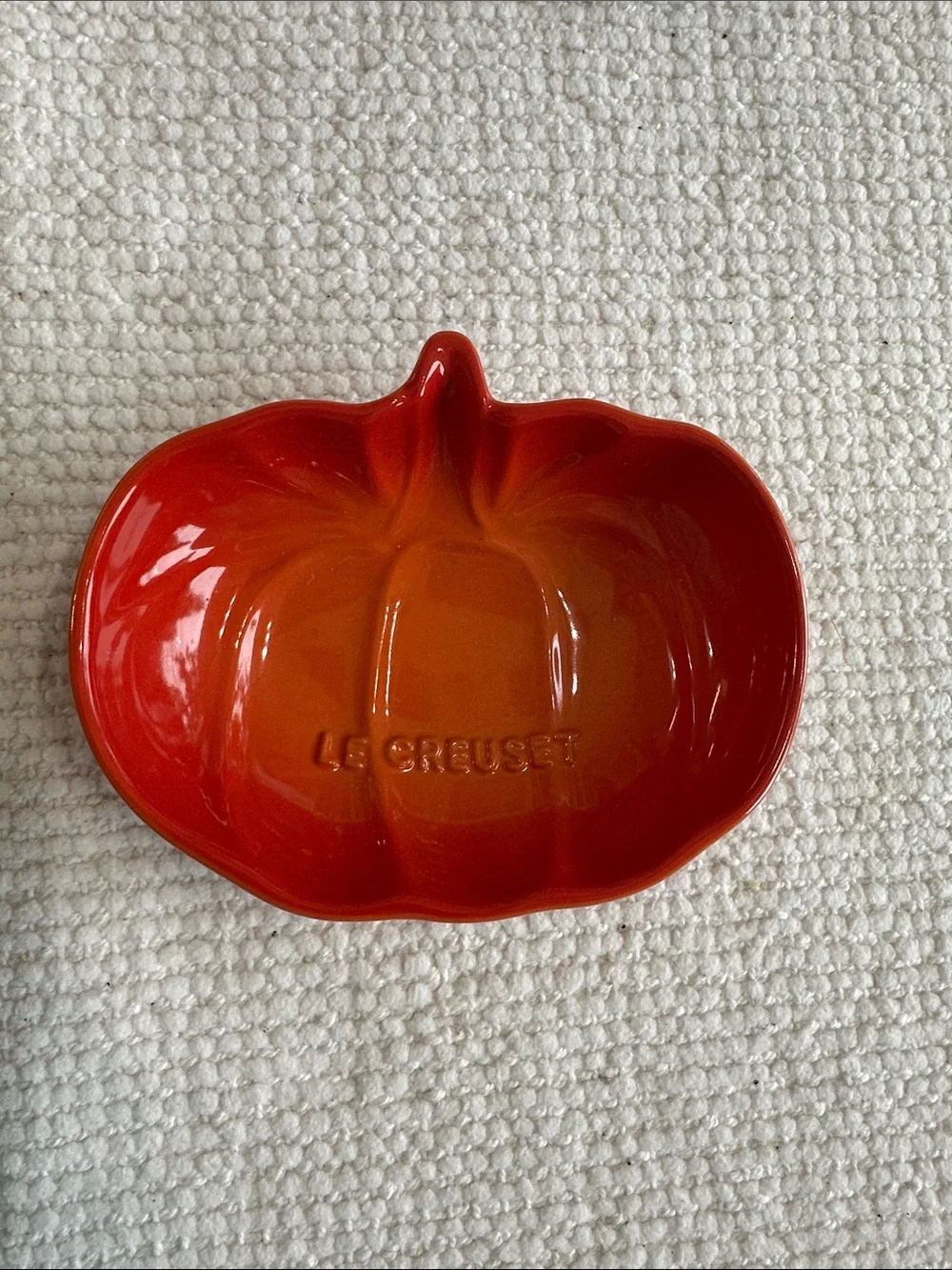 Le Creuset pumpkin-shaped small dish in Volcanic Orange glaze